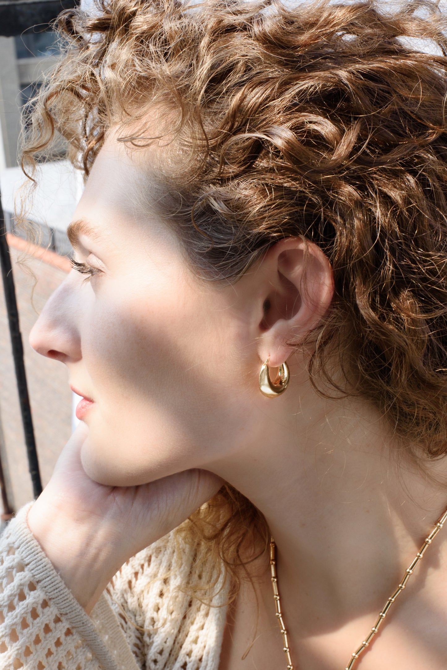 The Everri Day Huggies are a sleek and modern take on the classic hoop earring, inspired by the elegant curve of a half-moon. These solid, half-moon shaped earrings are meticulously crafted and plated with gold, representing balance and serenity. With a minimalist design that hugs the ear closely, they offer a chic look that seamlessly transitions from day to night, adding a subtle celestial charm to any outfit and celebrating personal evolution and style.