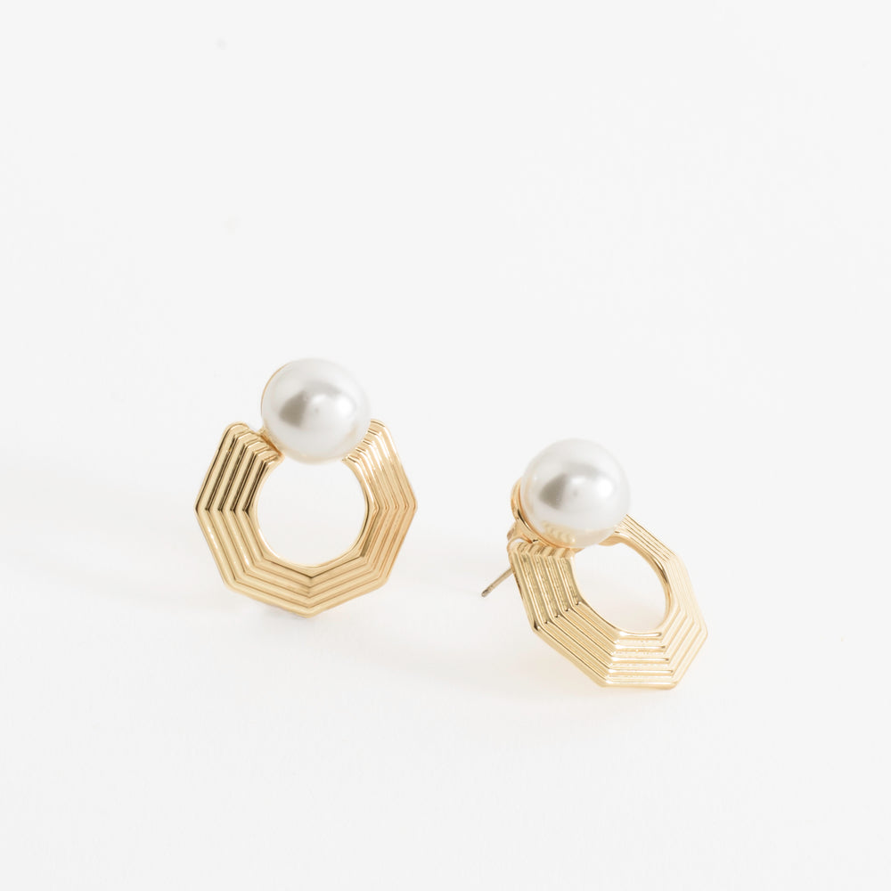 Close-up of the Harmony Hex Drop Earrings, featuring a sleek hexagon silhouette with a delicate pearl drop, blending geometric strength with timeless elegance.