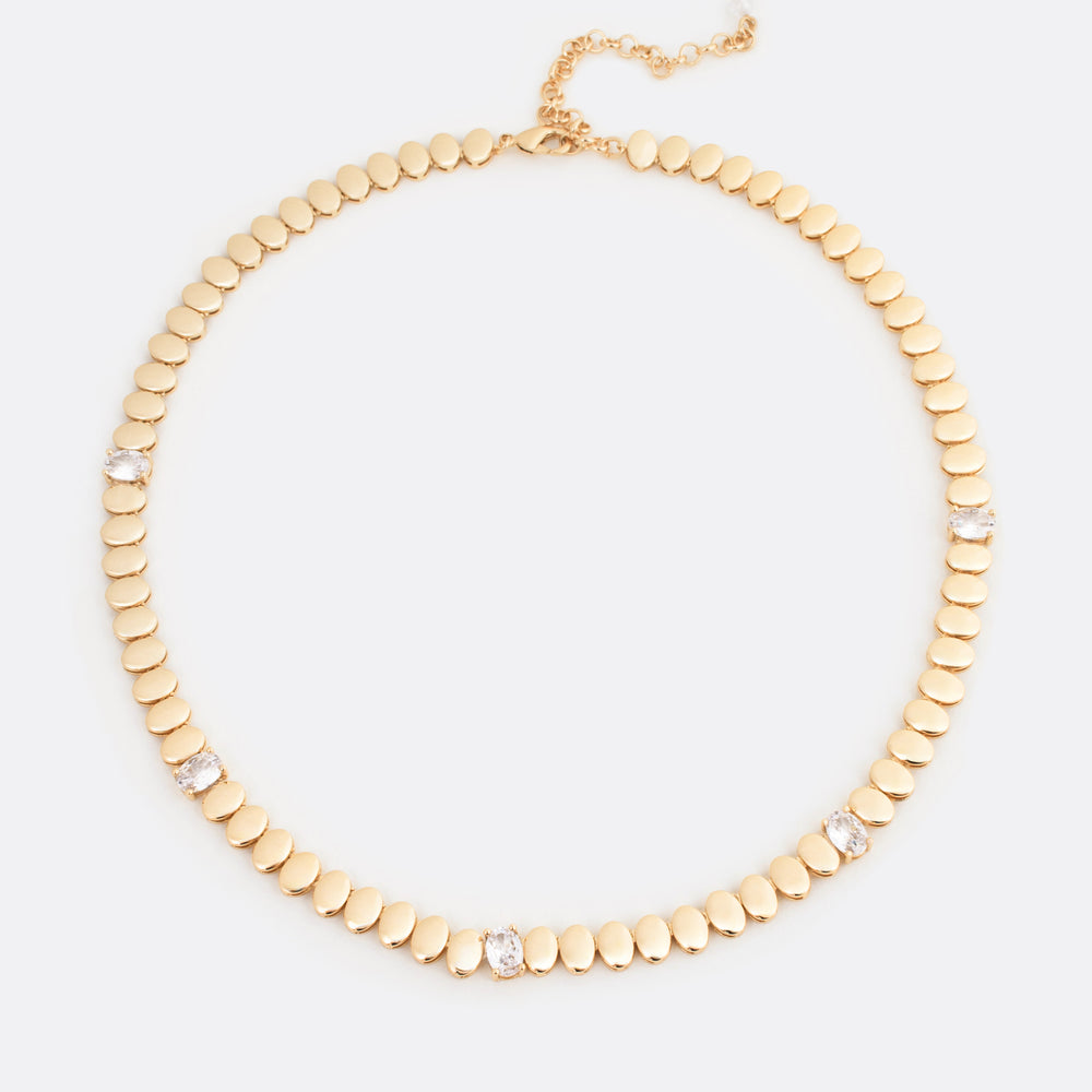 Close-up of the Gilded Harmony Necklace, featuring interlocking gold beads and radiant diamonds, blending timeless sophistication with modern allure.