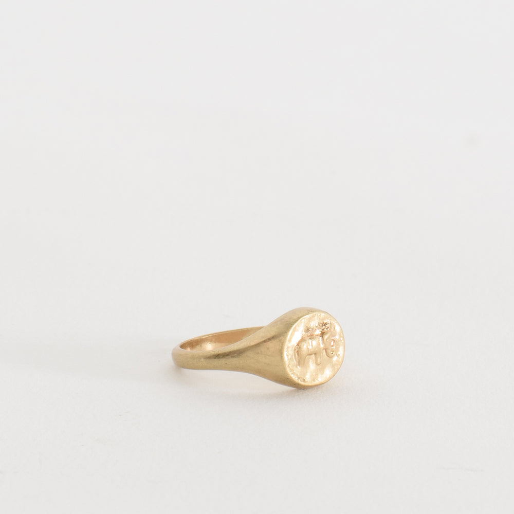 
                  
                    The Guardian of Wisdom Ring exudes timeless elegance and strength with its vintage-inspired design. Featuring an intricate elephant relief at its center, this signet ring symbolizes wisdom, protection, and resilience. Its antique finish evokes the feel of a cherished heirloom, like a treasure rediscovered in a forgotten attic. The elephant, a symbol of knowledge and family protection, serves as a reminder of strength through wisdom, making this ring a meaningful keepsake and statement piece for any jewelry
                  
                